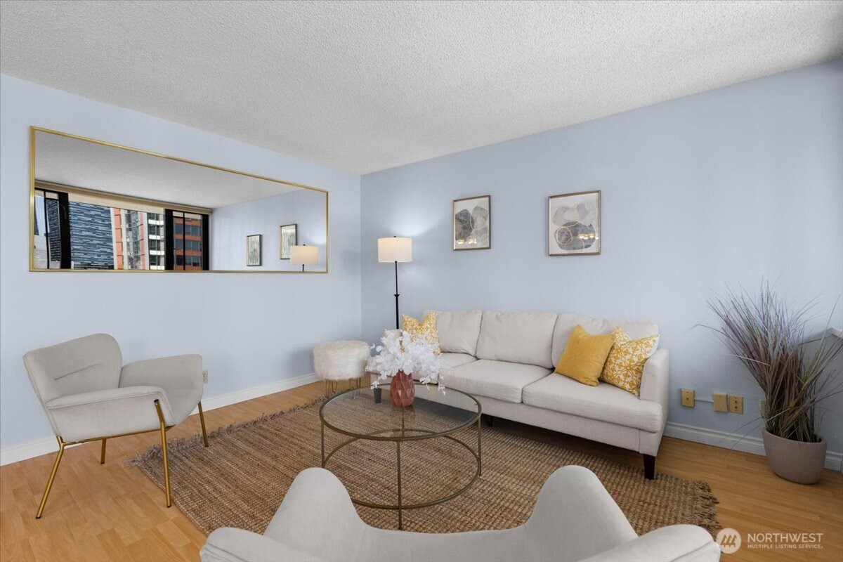 2100 3rd Avenue, Unit 2505 Seattle, WA 98121 - Photo 5 of 40 a living room with furniture and a potted plant