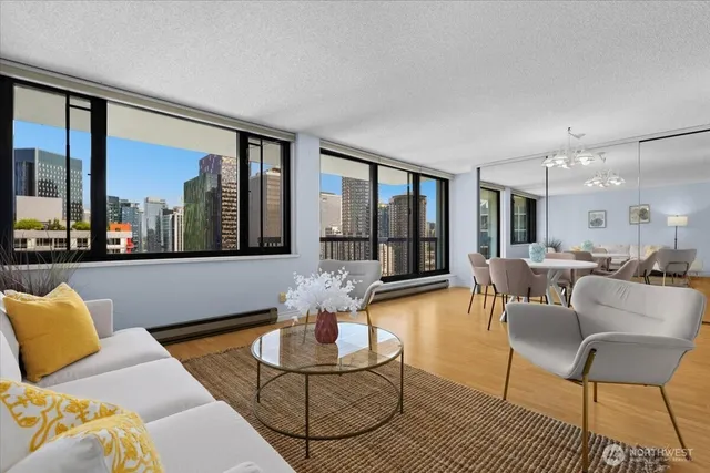 a living room with furniture and a large window