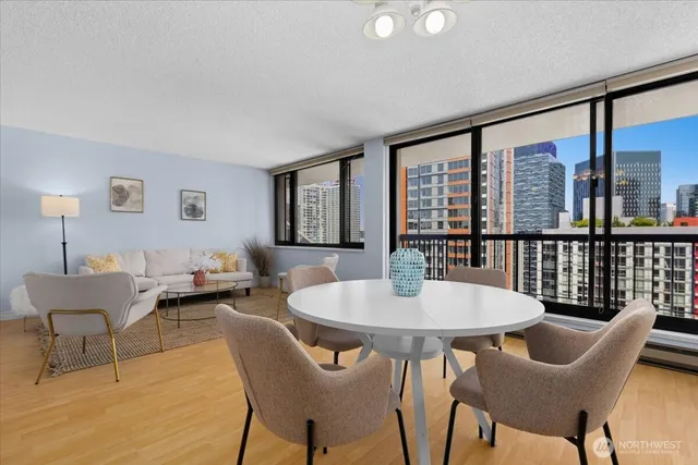 a view of a dining room with furniture window and wooden floor