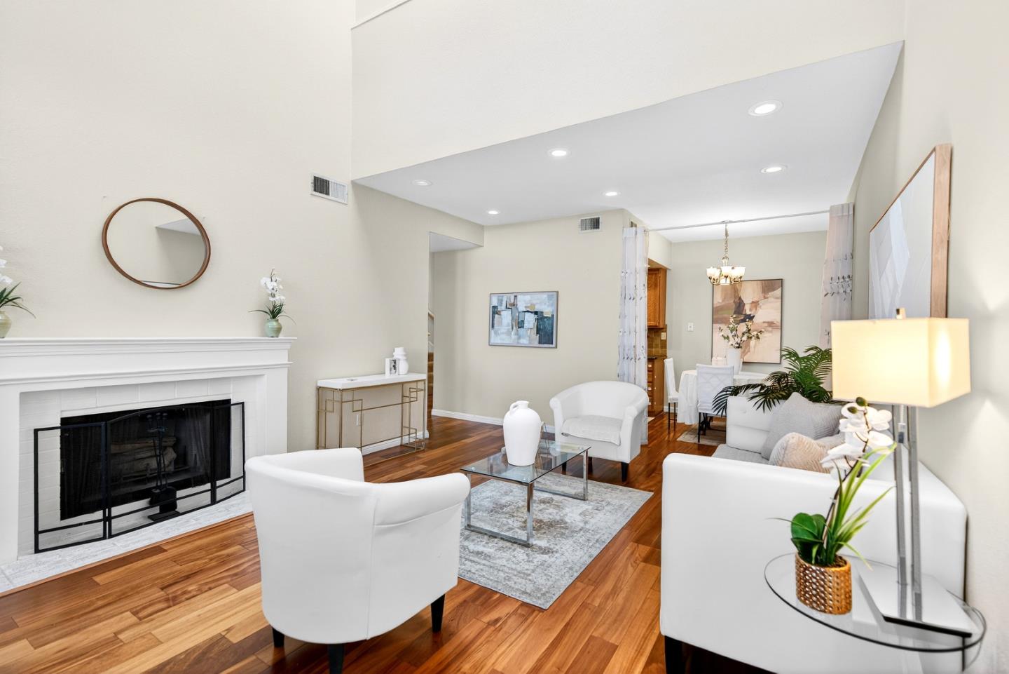 22330 Homestead Road, Unit 214 Cupertino, CA 95014 - Photo 12 of 35 a living room with furniture a fireplace and a table