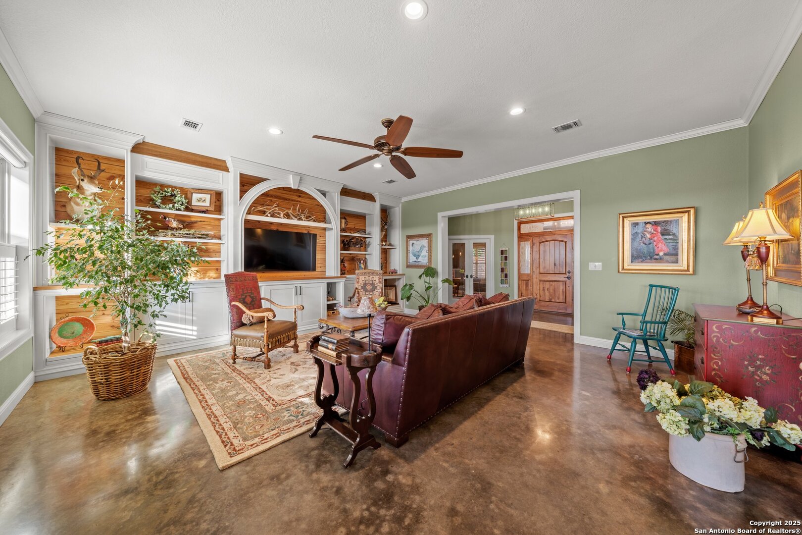 34 Rusty Spur Drive Fredericksburg, TX 78624 - Photo 19 of 49 a living room with furniture flat screen tv and a large window