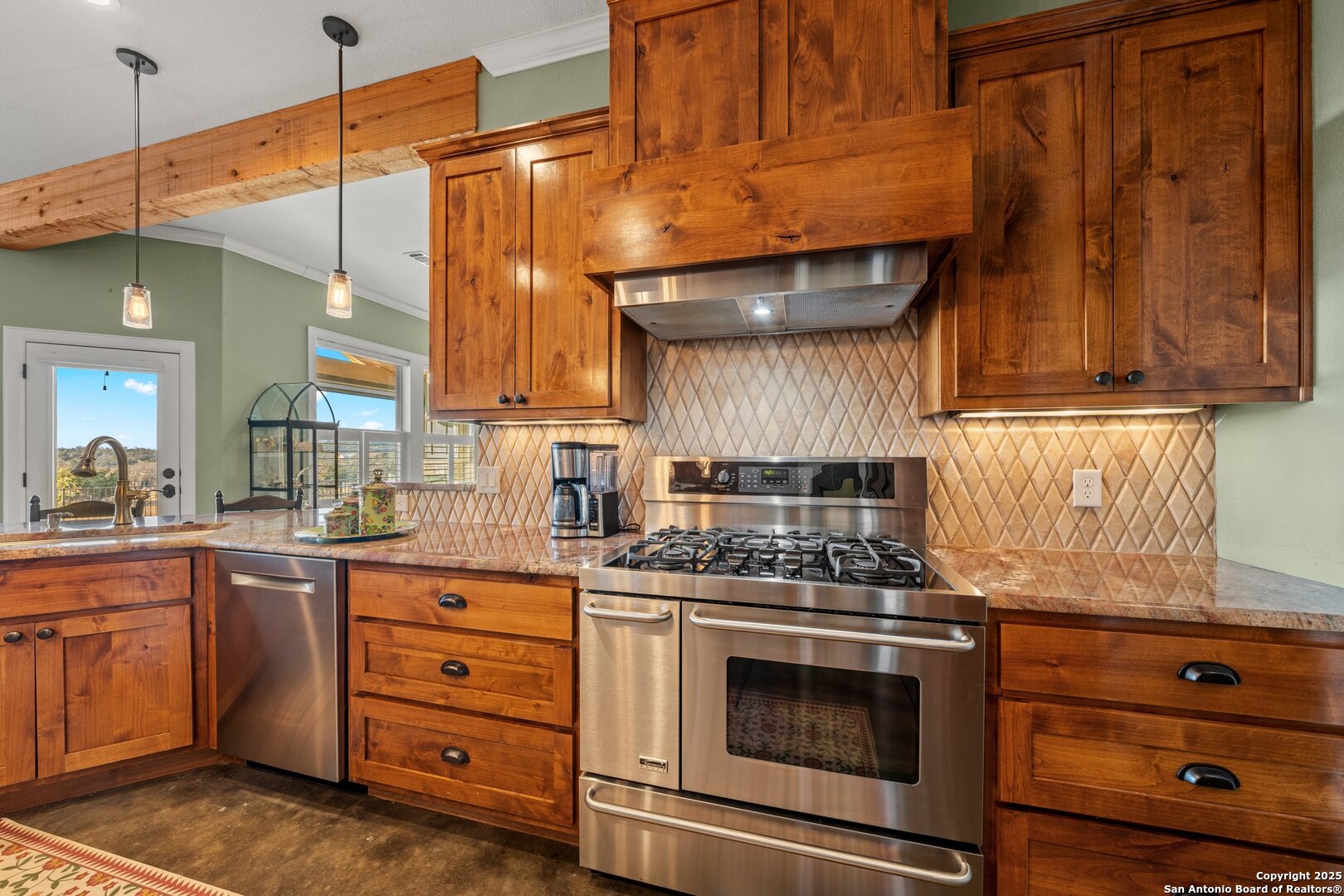 34 Rusty Spur Drive Fredericksburg, TX 78624 - Photo 21 of 49 a kitchen with a stove and a microwave