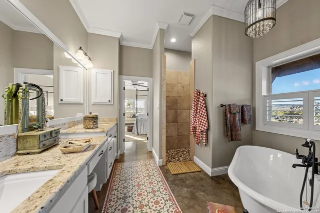 a large spacious bathroom with a double vanity sink a mirror and a bathtub