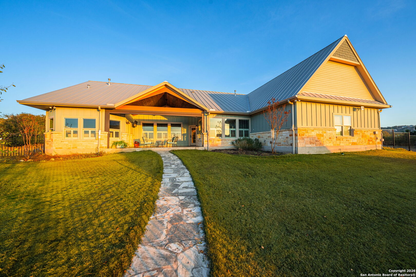 34 Rusty Spur Drive Fredericksburg, TX 78624 - Photo 38 of 49 a front view of a house with a yard