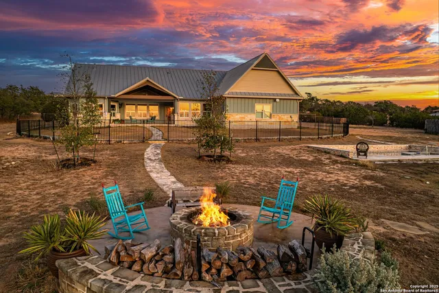 a view of multiple houses with yard
