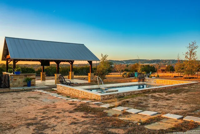 swimming pool view with a outdoor seating