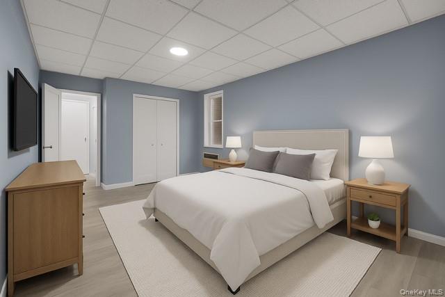609 Palmer Road, Unit 3M Yonkers, NY 10701 - Photo 12 of 18 Virtually Staged spacious bedroom featuring a drop ceiling, light wood-style flooring, and a closet