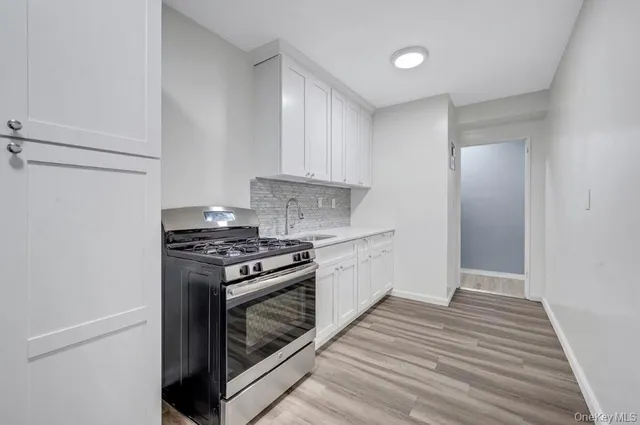 a kitchen with a stove and a microwave