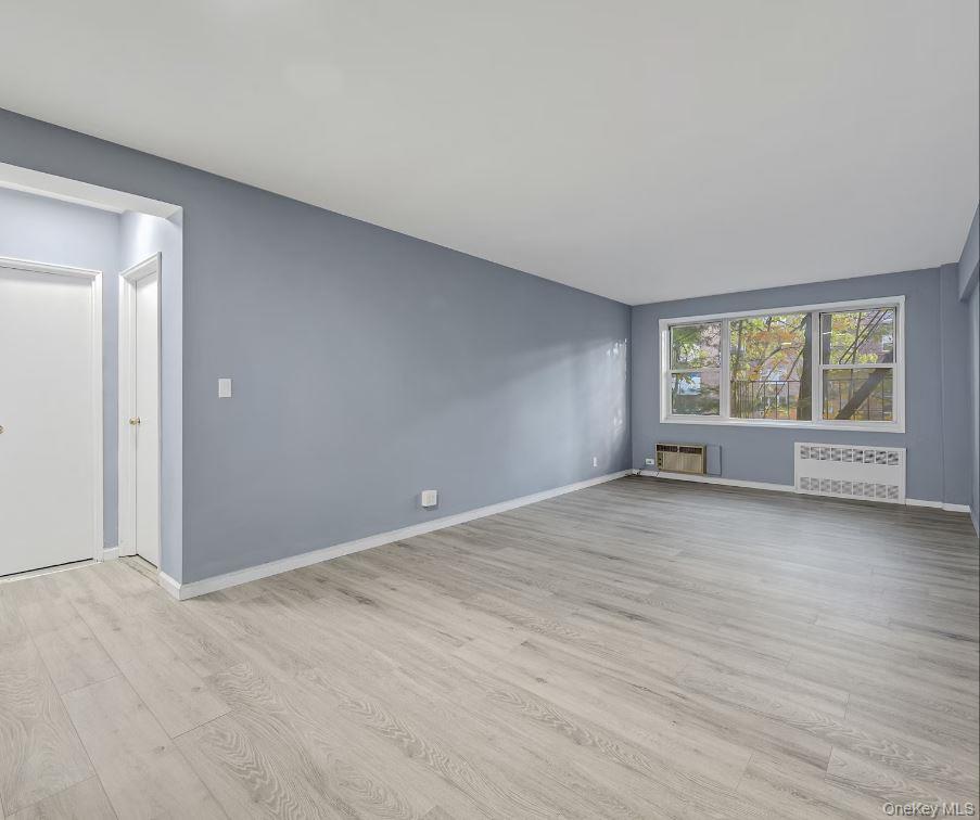 609 Palmer Road, Unit 3M Yonkers, NY 10701 - Photo 6 of 18 View of part of the living room with entrance to hallway leading to closet, bathroom, and bedroom.