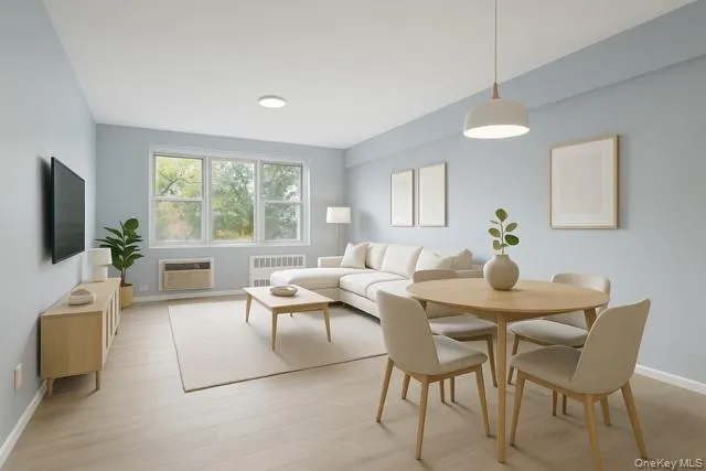a view of a dining room with furniture a livingroom and chandelier