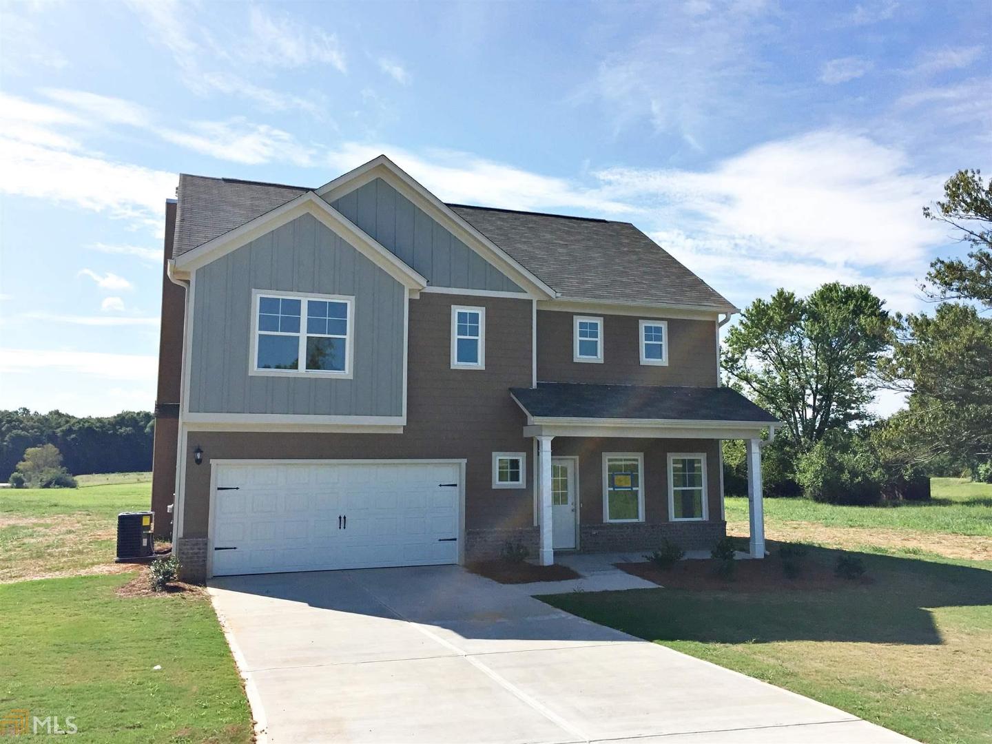1131 Bethlehem Road, Unit TRACT 1 Statham, GA 30666 - Photo 1 of 1 a front view of a house with a yard