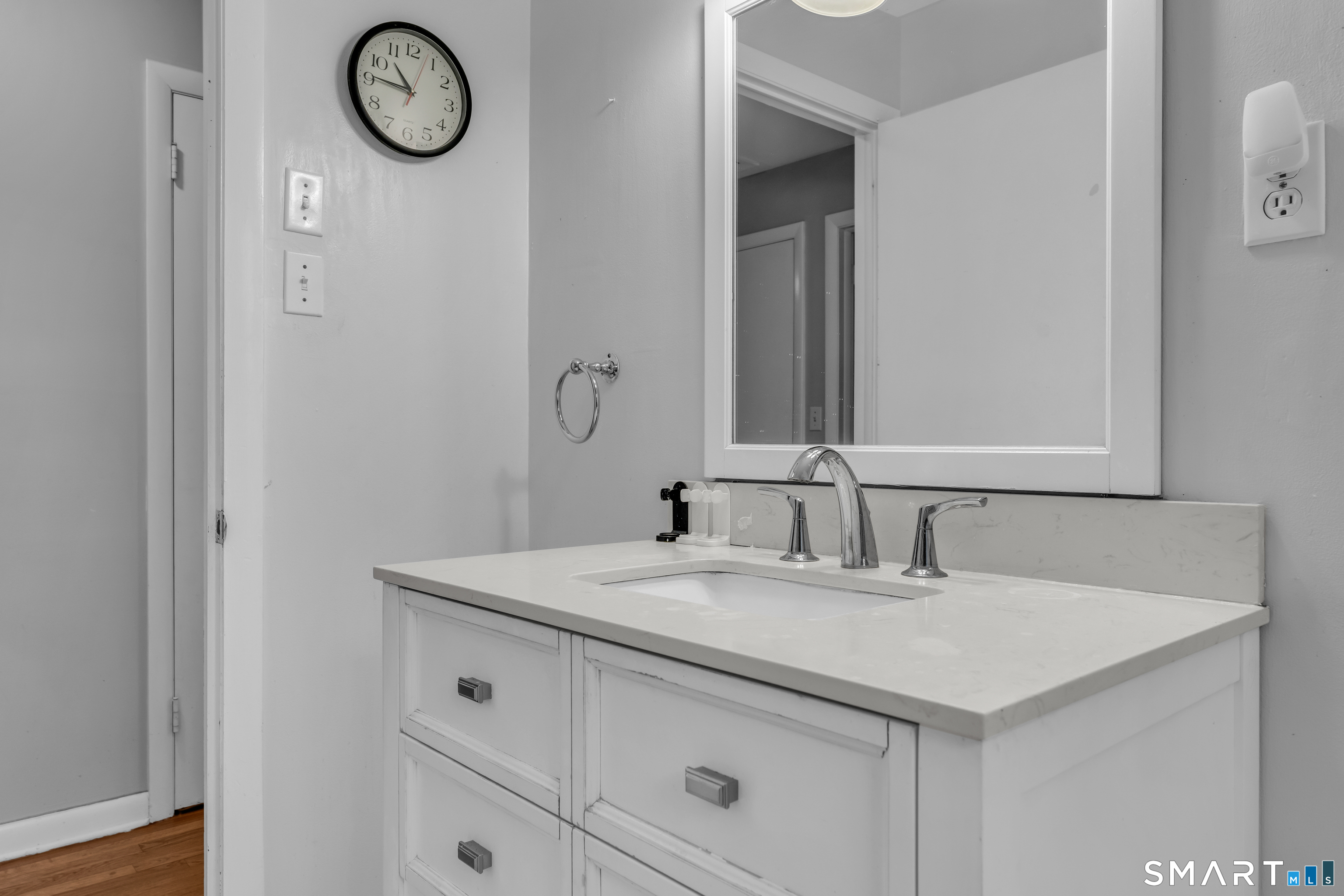 43 Fort Path Road Madison, CT 06443 - Photo 20 of 40 a bathroom with a sink and a mirror