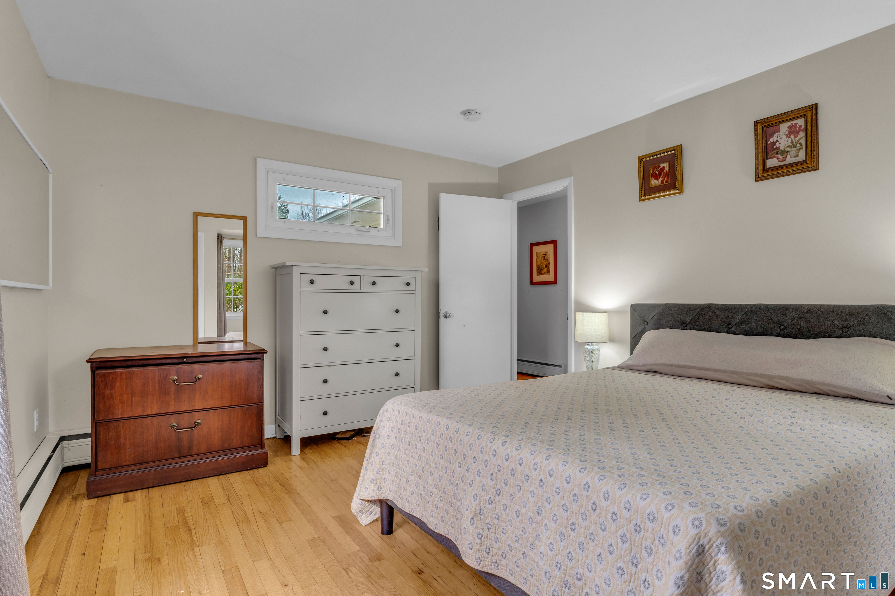 43 Fort Path Road Madison, CT 06443 - Photo 24 of 40 a bedroom with a bed and furniture