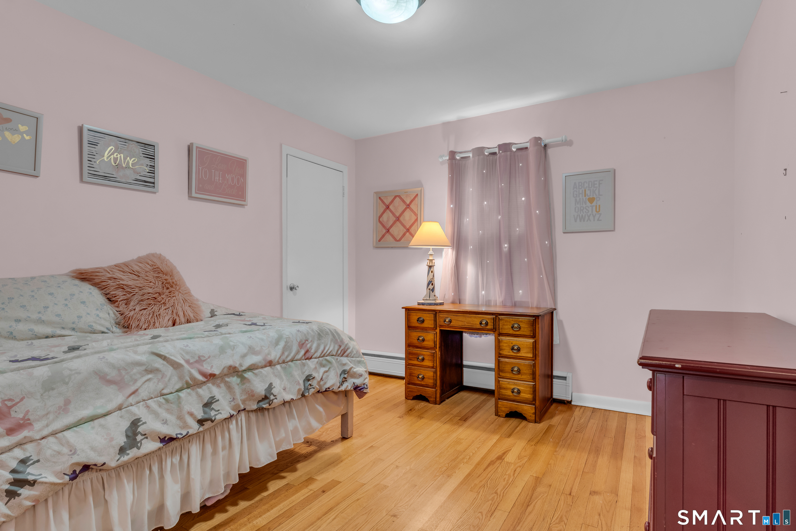 43 Fort Path Road Madison, CT 06443 - Photo 25 of 40 a bedroom with a bed and a dresser