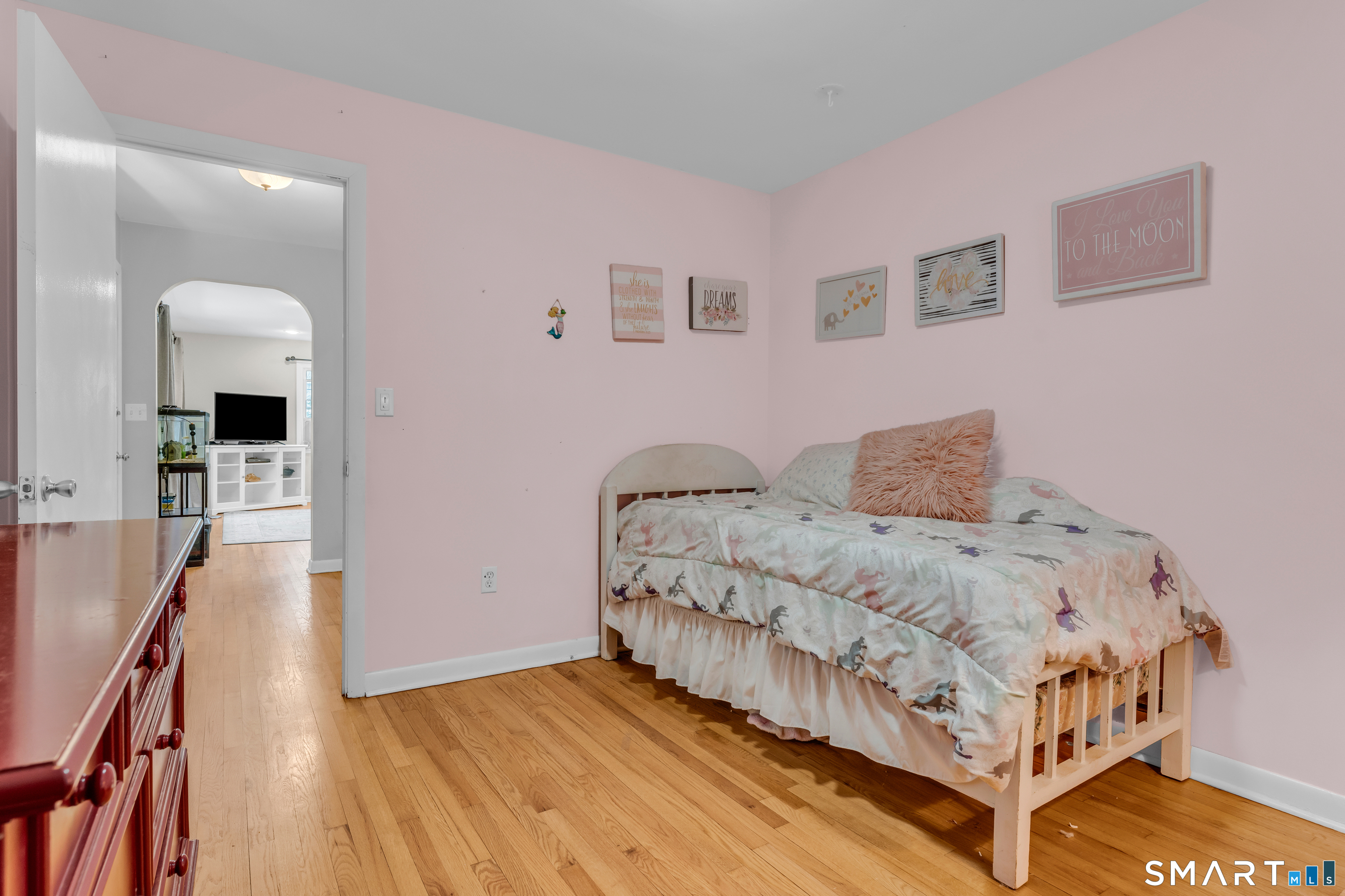 43 Fort Path Road Madison, CT 06443 - Photo 26 of 40 a bedroom with a bed and a view of kitchen