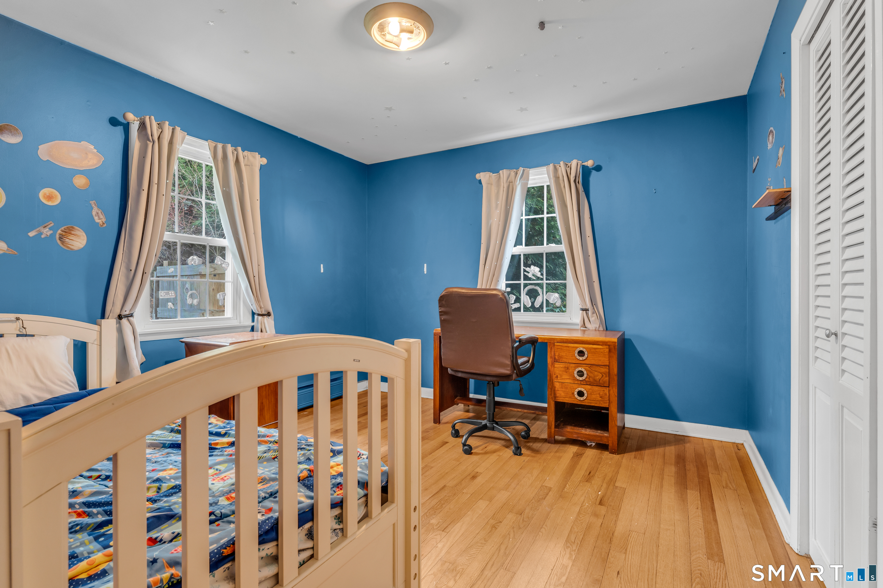 43 Fort Path Road Madison, CT 06443 - Photo 27 of 40 a bedroom with a bed and a window