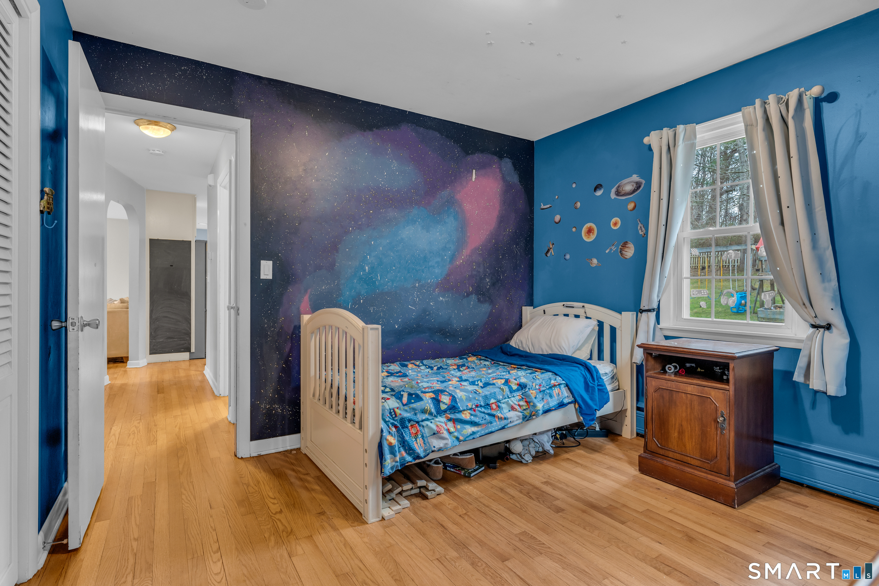 43 Fort Path Road Madison, CT 06443 - Photo 28 of 40 a bedroom with a bed and a large window