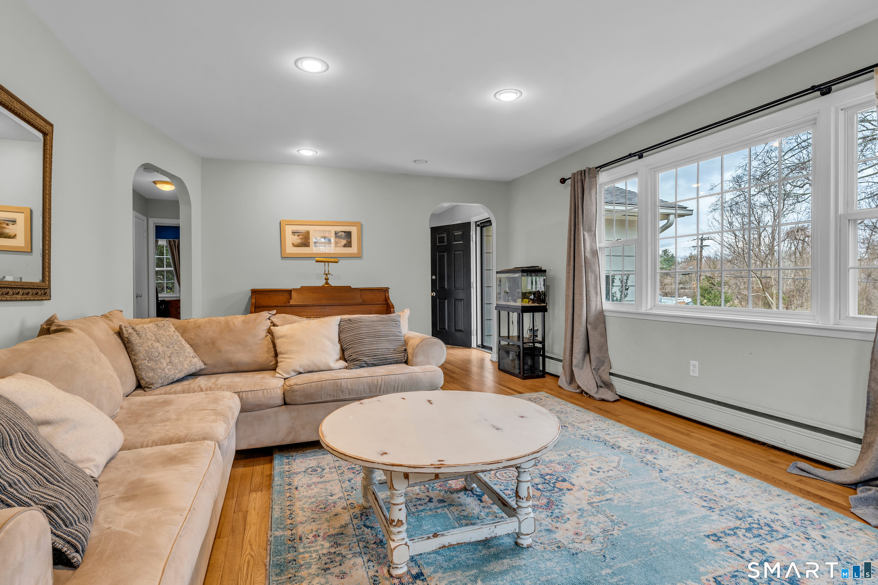 43 Fort Path Road Madison, CT 06443 - Photo 9 of 40 a living room with furniture and a large window