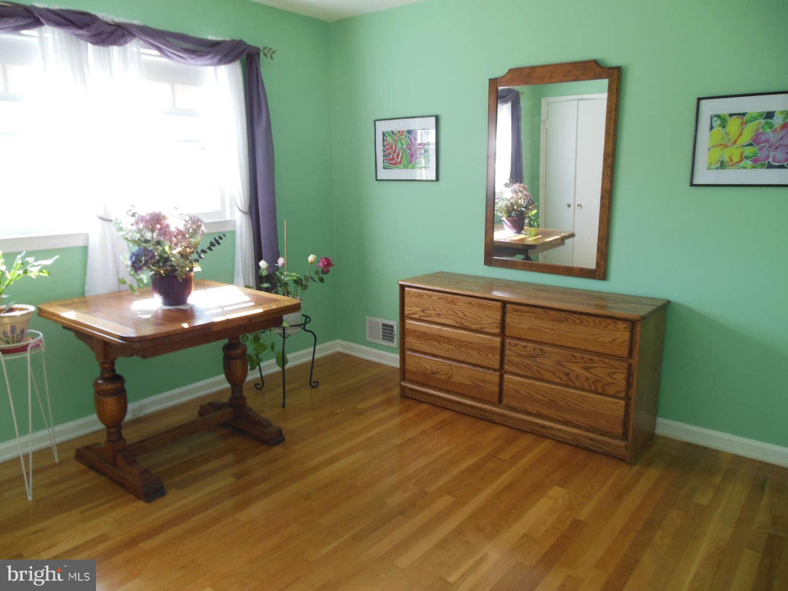 1608 Arbor View Road Silver Spring, MD 20902 - Photo 17 of 28 a room with furniture and a window