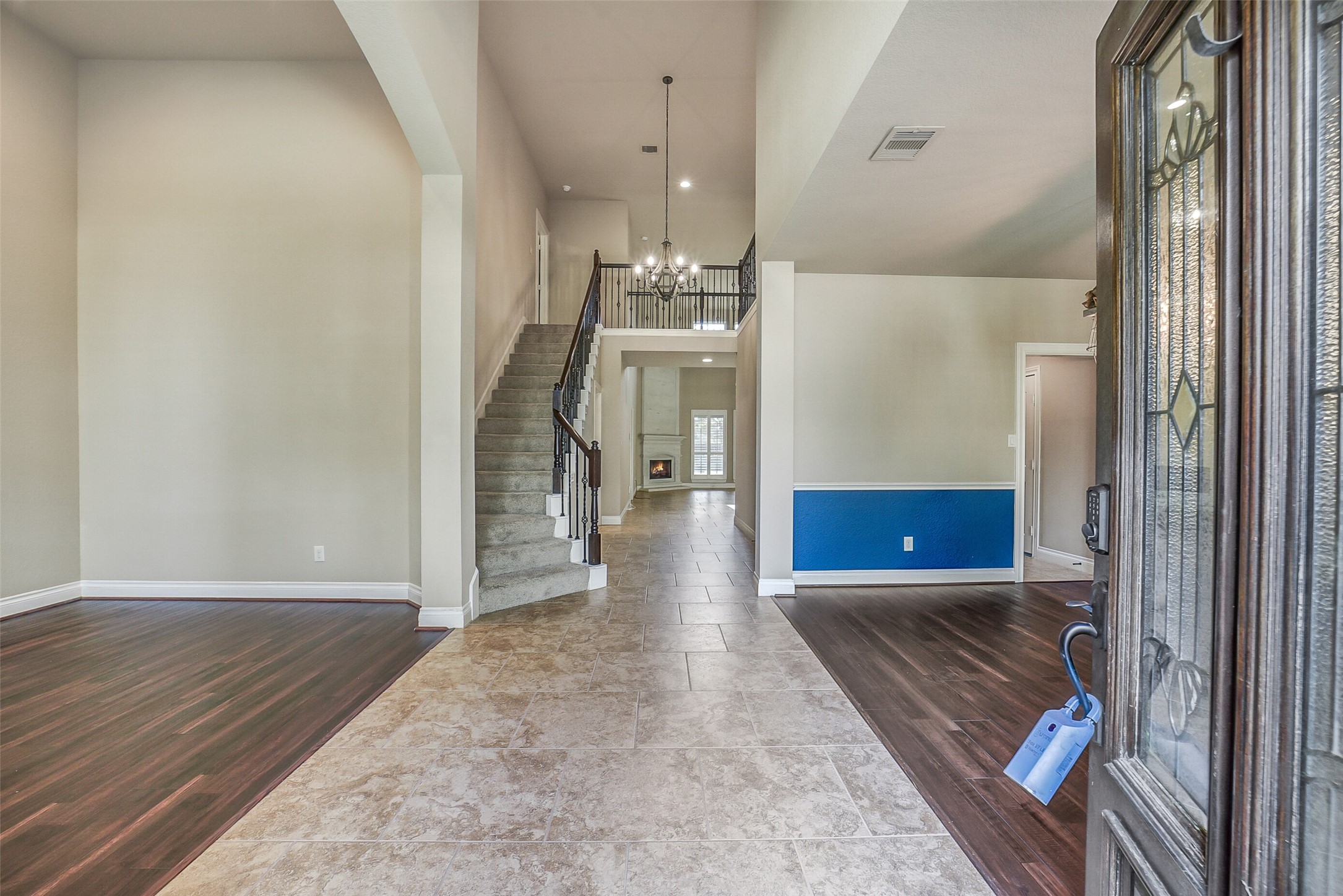 6413 Delta Crossing Court Rosenberg, TX 77471 - Photo 5 of 46 a view of a hallway view with wooden floor and staircase