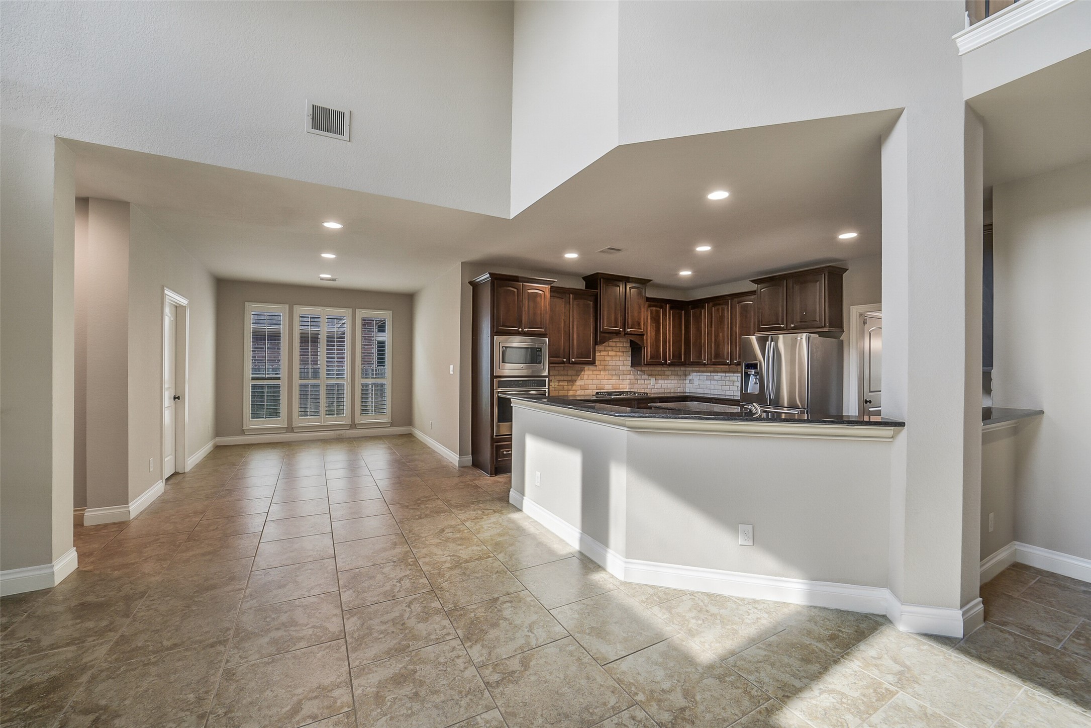 6413 Delta Crossing Court Rosenberg, TX 77471 - Photo 9 of 46 a view of kitchen with refrigerator and window
