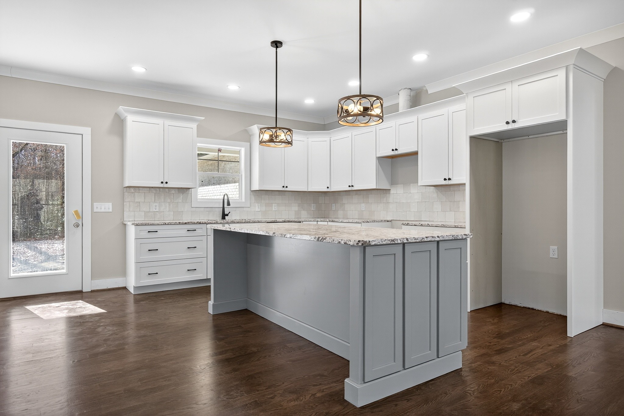 2 Browder Point Monterey, TN 38574 - Photo 16 of 51 a kitchen with stainless steel appliances granite countertop a stove a sink a center island a refrigerator and a wooden floor