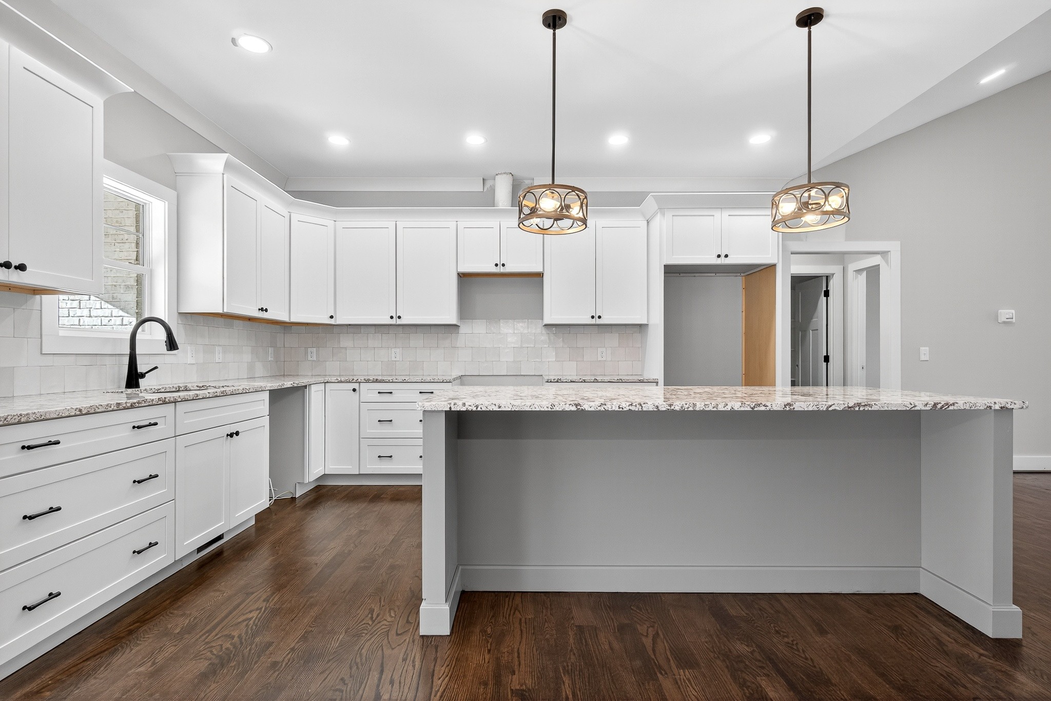 2 Browder Point Monterey, TN 38574 - Photo 17 of 51 a kitchen with stainless steel appliances granite countertop a sink a stove and a wooden floor