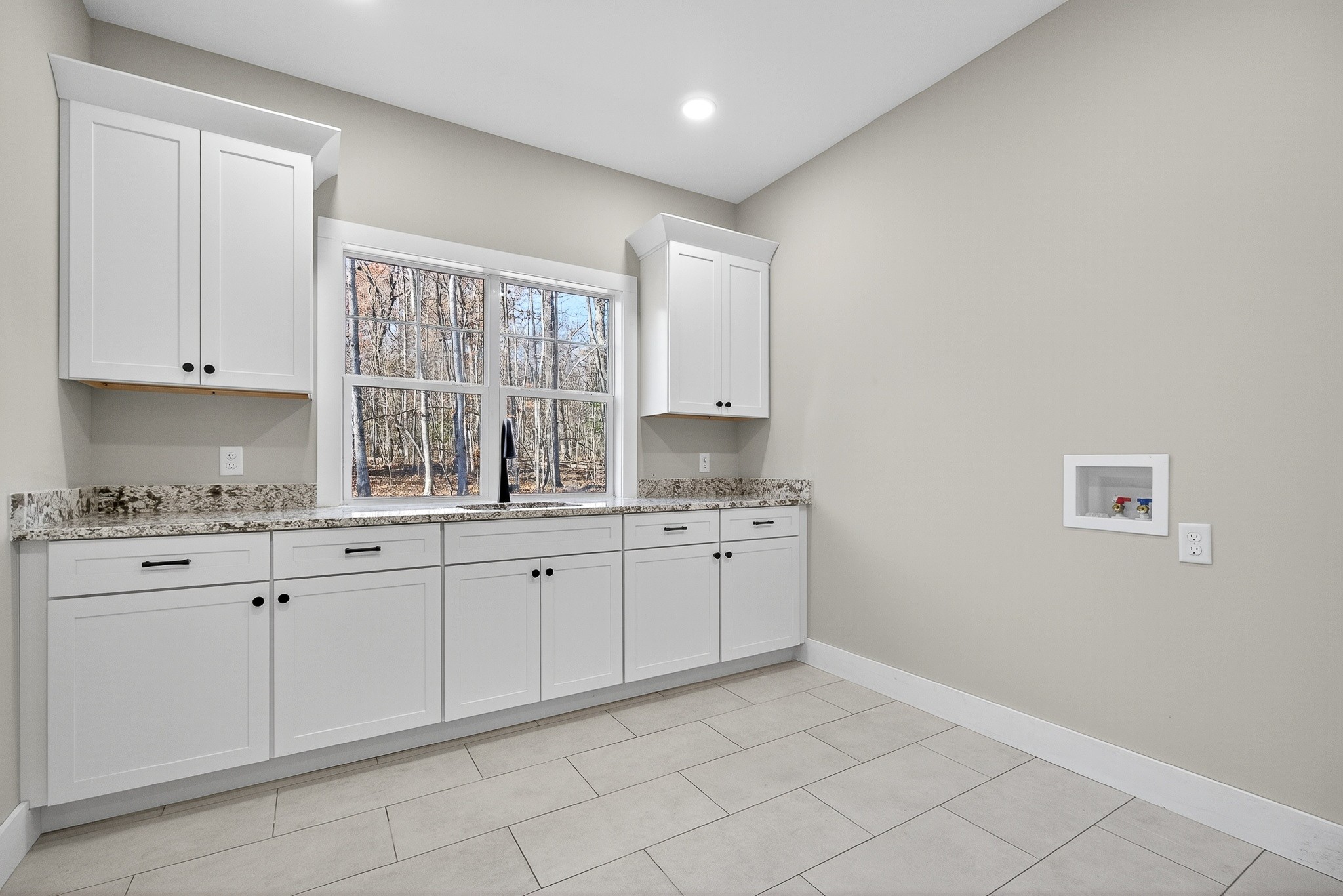 2 Browder Point Monterey, TN 38574 - Photo 32 of 51 a kitchen with granite countertop white cabinets and a window