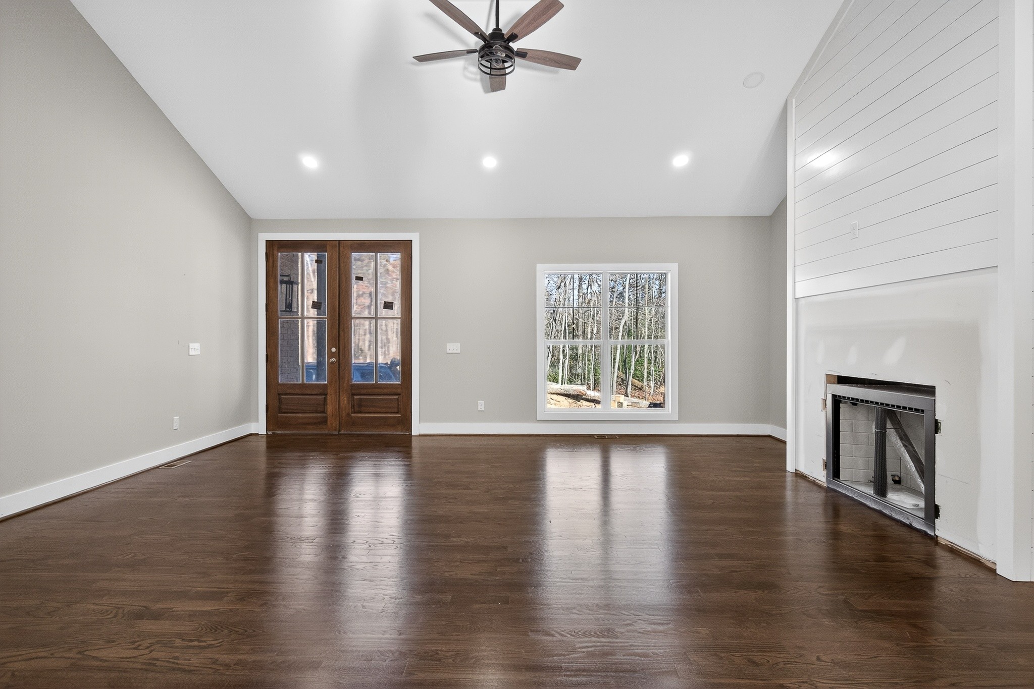 2 Browder Point Monterey, TN 38574 - Photo 10 of 51 an empty room with wooden floor a fireplace and windows