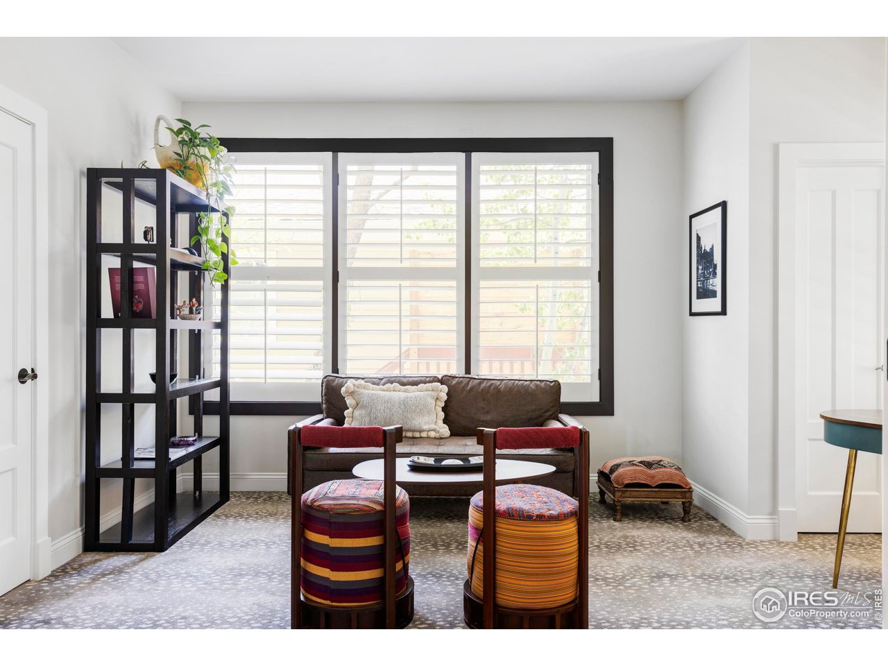 3132 5th Street Boulder, CO 80304 - Photo 10 of 27 a living room with furniture a flat screen tv and a window