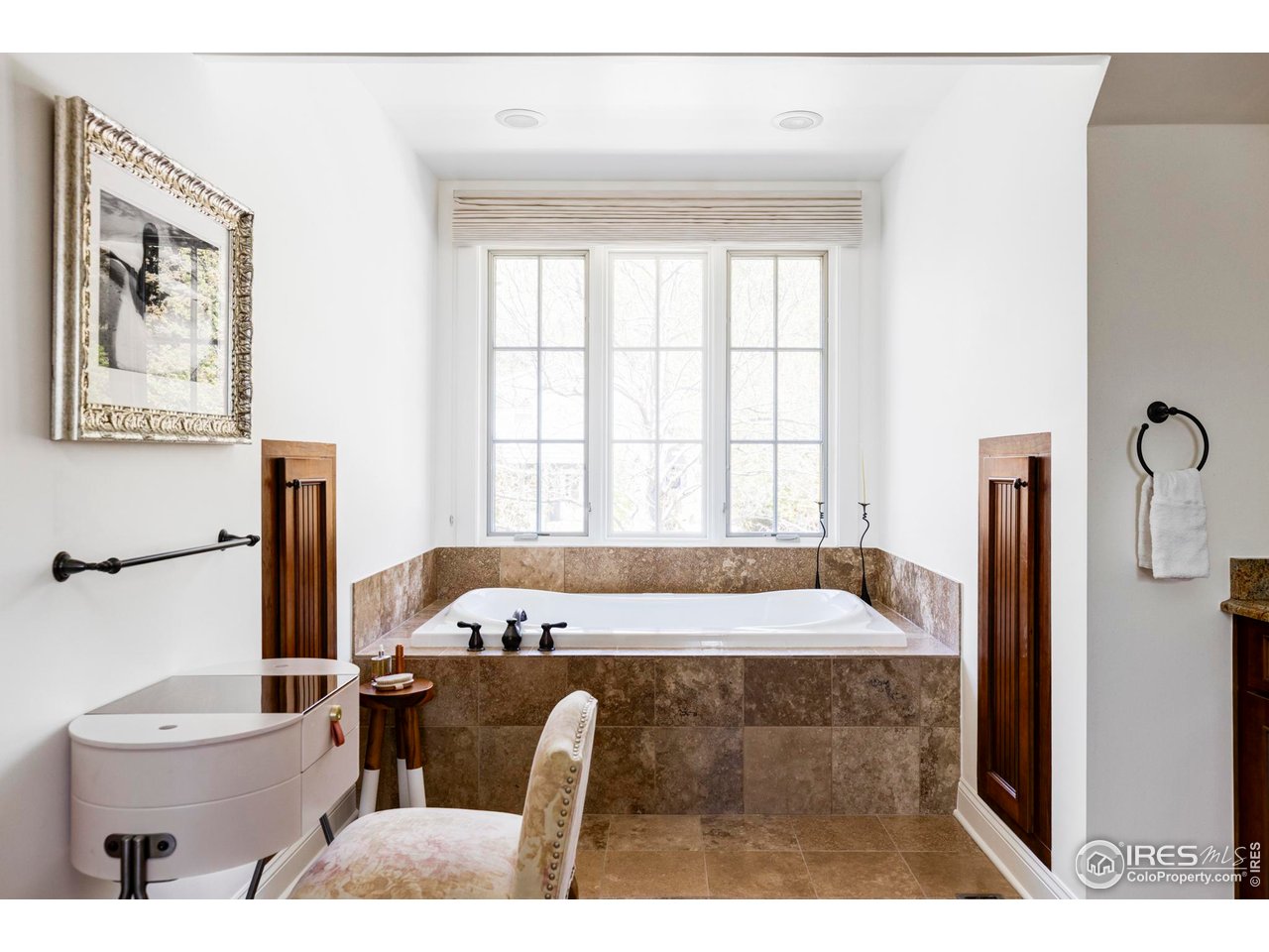3132 5th Street Boulder, CO 80304 - Photo 17 of 27 a spacious bedroom with a bed and a flat screen tv