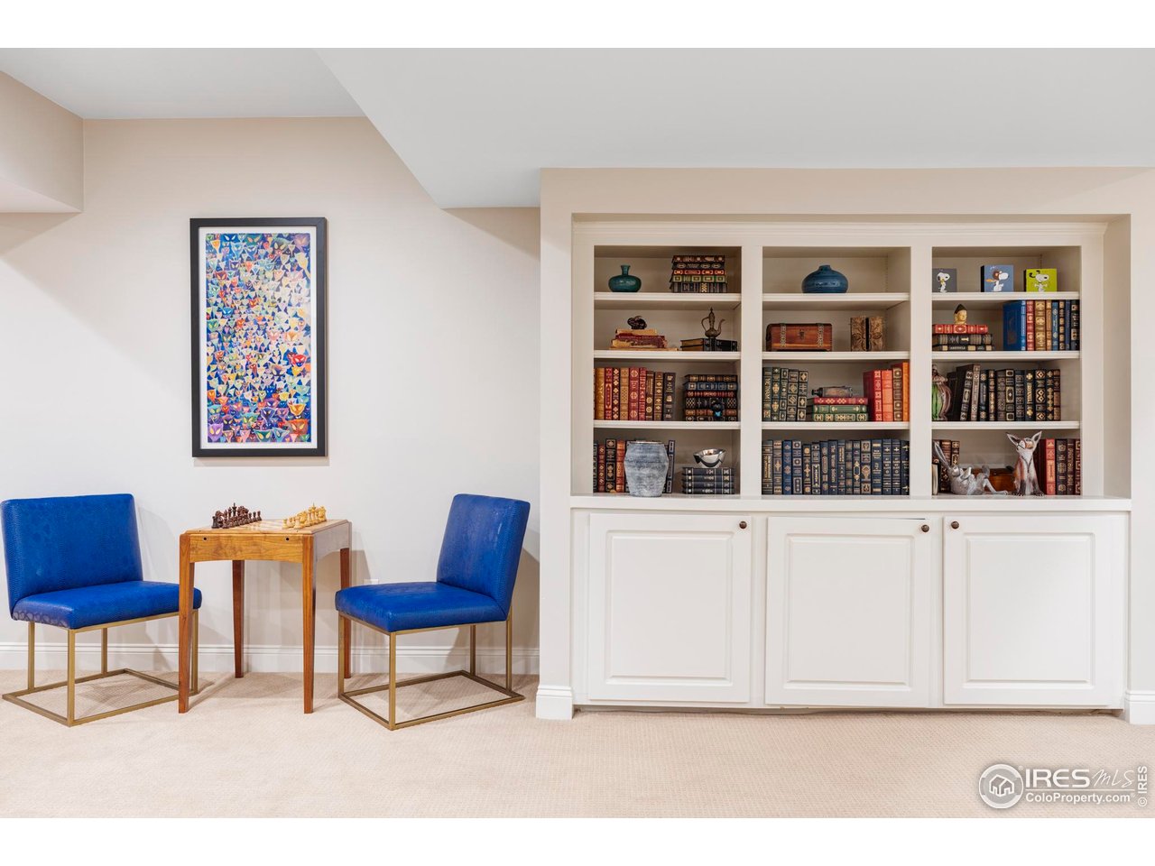 3132 5th Street Boulder, CO 80304 - Photo 19 of 27 a living room with furniture and a book shelf