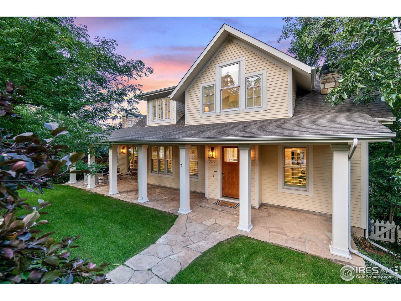 3132 5th Street Boulder, CO 80304 - Photo 26 of 27 a front view of a house with a yard and garage