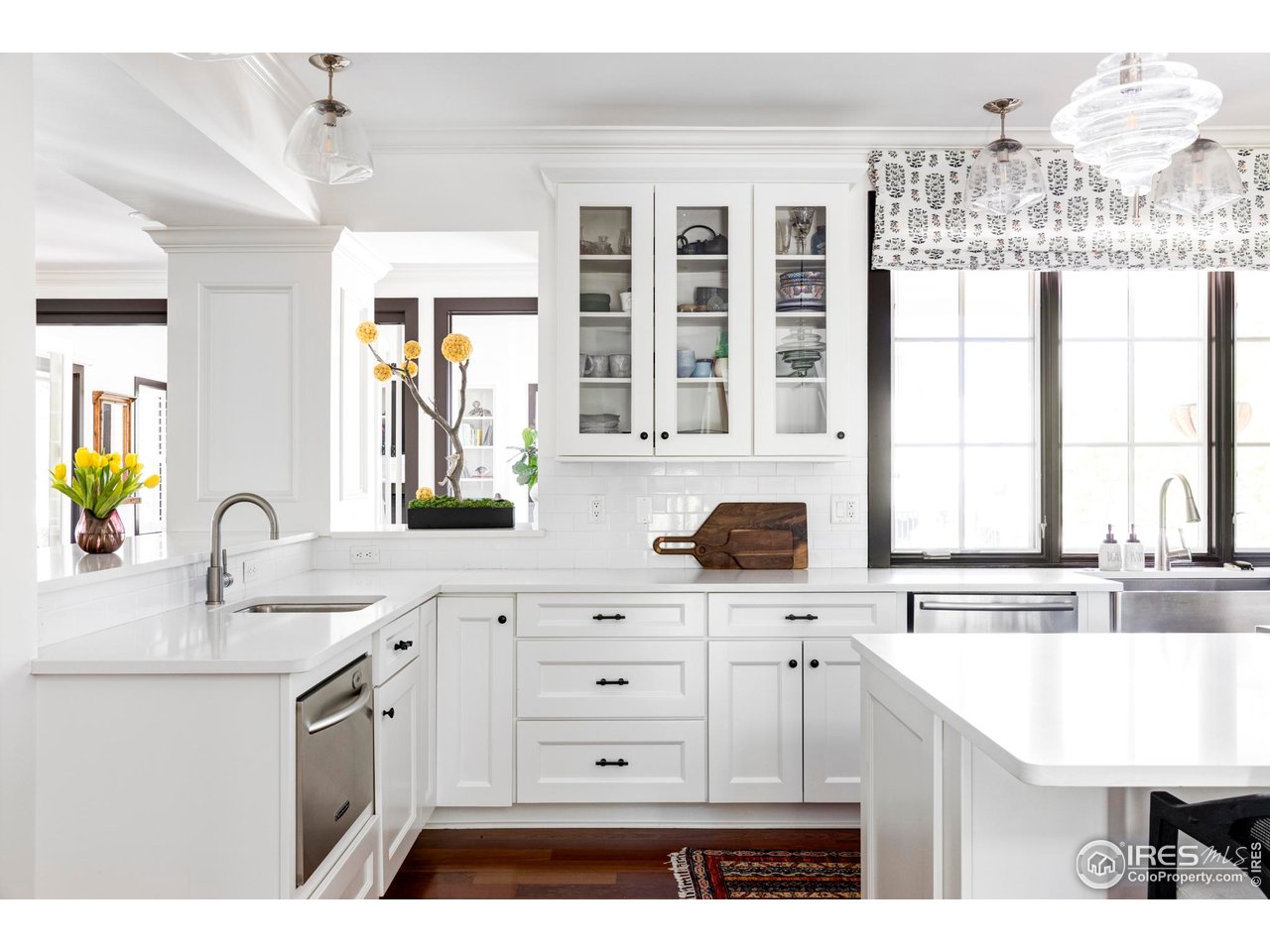 3132 5th Street Boulder, CO 80304 - Photo 3 of 27 a kitchen with a sink stove and cabinets