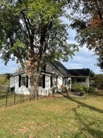 a front view of a building with garden