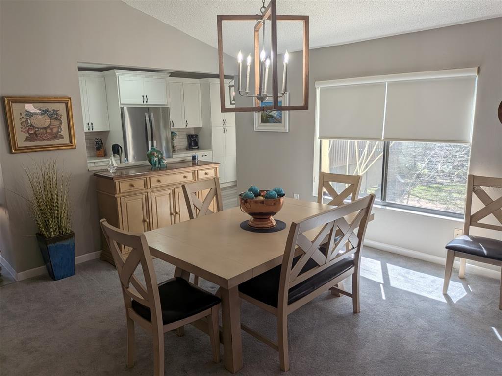 700 Starkey Road, Unit 821 Largo, FL 33771 - Photo 13 of 29 a view of a dining room with furniture window and outside view