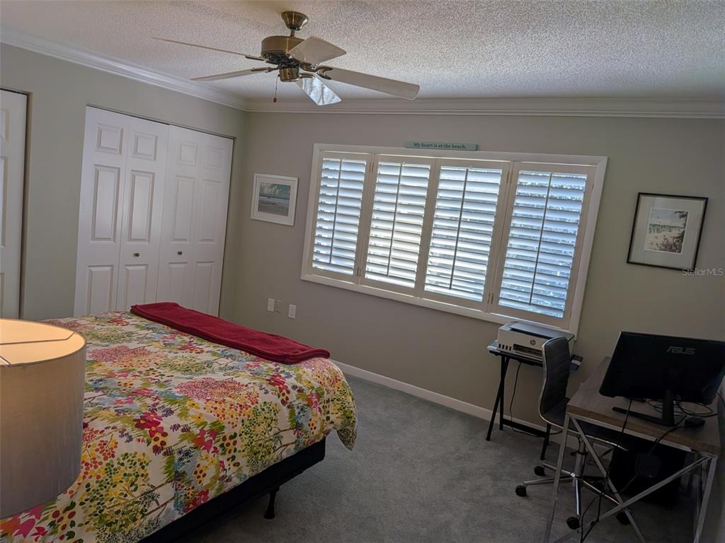700 Starkey Road, Unit 821 Largo, FL 33771 - Photo 14 of 29 a bedroom with a bed and a window