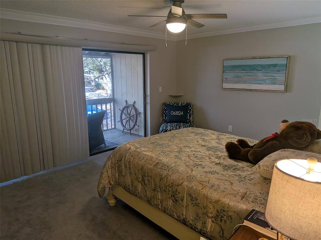 700 Starkey Road, Unit 821 Largo, FL 33771 - Photo 19 of 29 a bed sitting in a bedroom next to a window