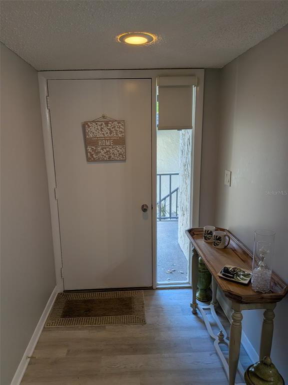 700 Starkey Road, Unit 821 Largo, FL 33771 - Photo 3 of 29 a view of a hallway with a stove