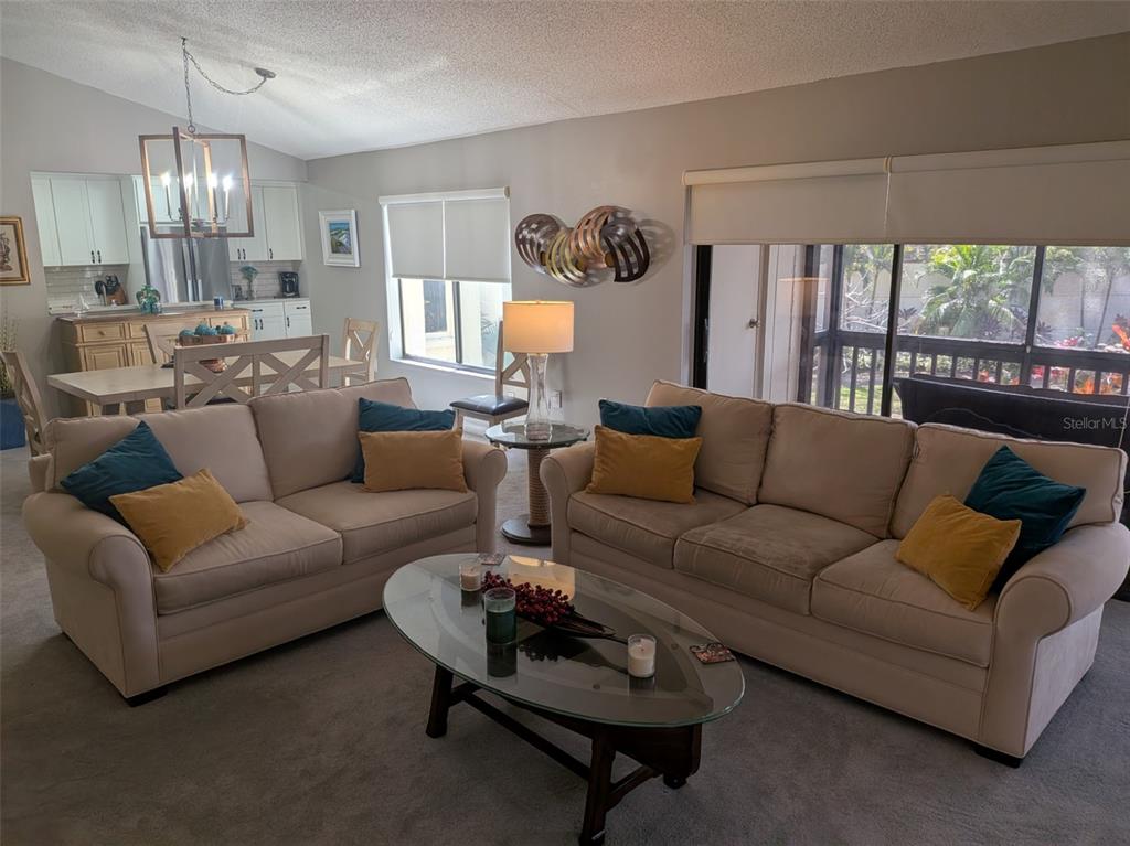 700 Starkey Road, Unit 821 Largo, FL 33771 - Photo 4 of 29 a living room with furniture and a large window