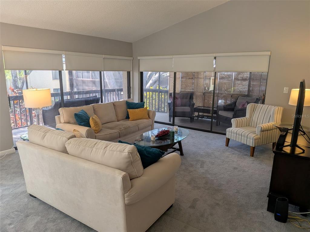 700 Starkey Road, Unit 821 Largo, FL 33771 - Photo 5 of 29 a living room with furniture and a large window