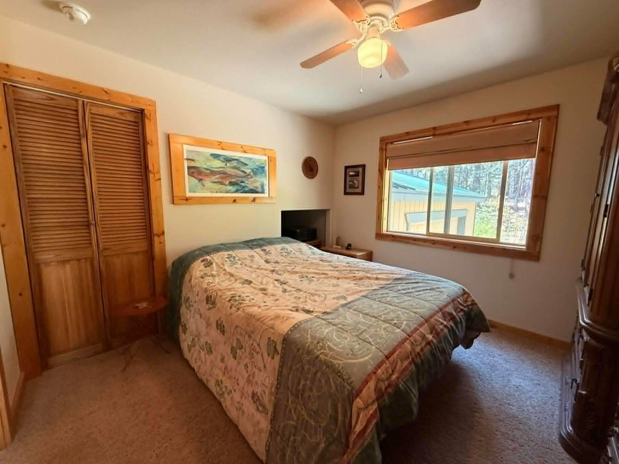 93 Juniper Road Beckwourth, CA 96129 - Photo 18 of 35 a bedroom with a bed and a window