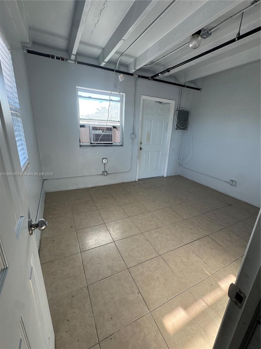 354 Rardin Avenue, Unit 12 Pahokee, FL 33476 - Photo 4 of 11 a view of a storage & utility room