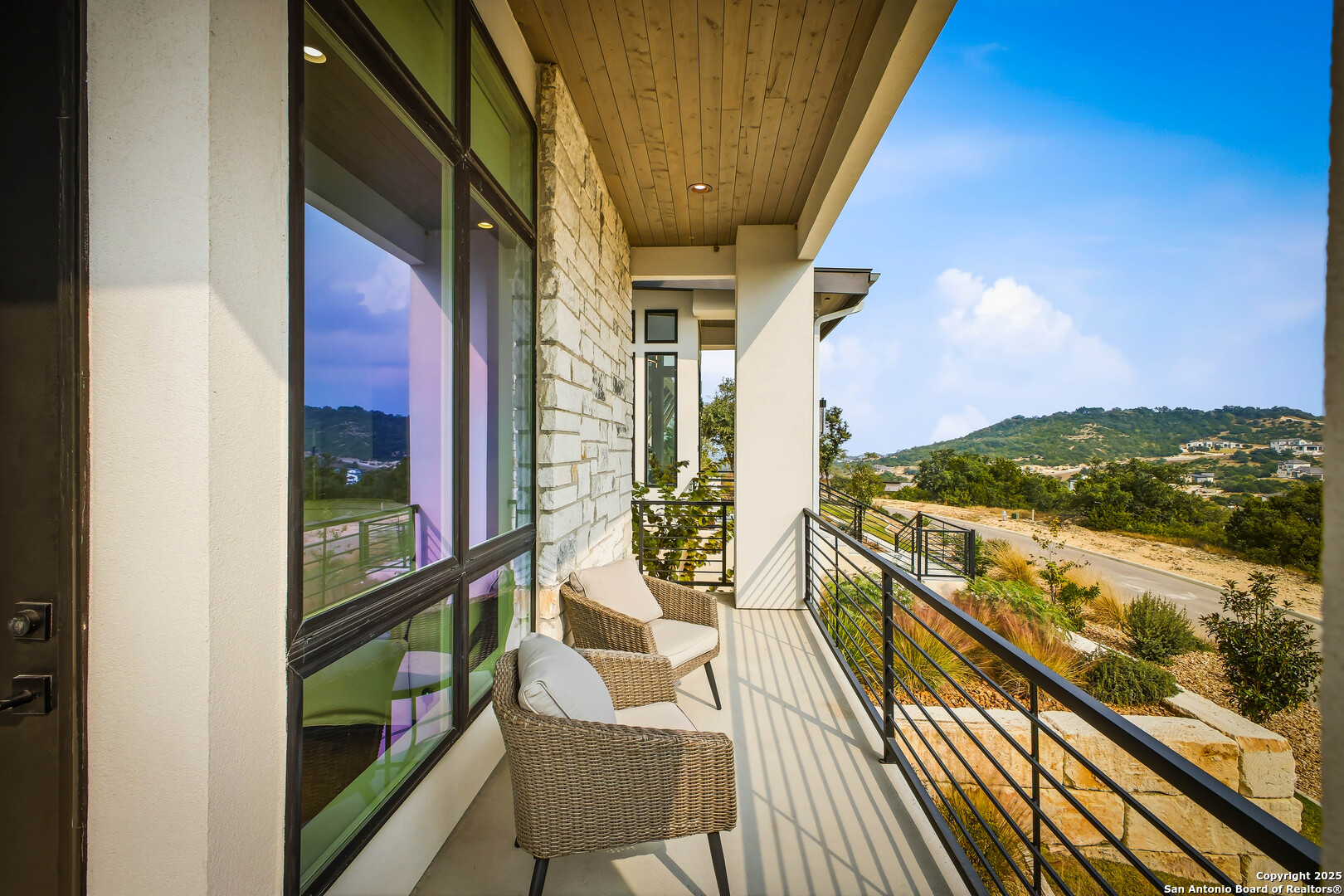 23315 Ebner Ridge San Antonio, TX 78255 - Photo 37 of 103 a view of balcony with wooden floor and seating space