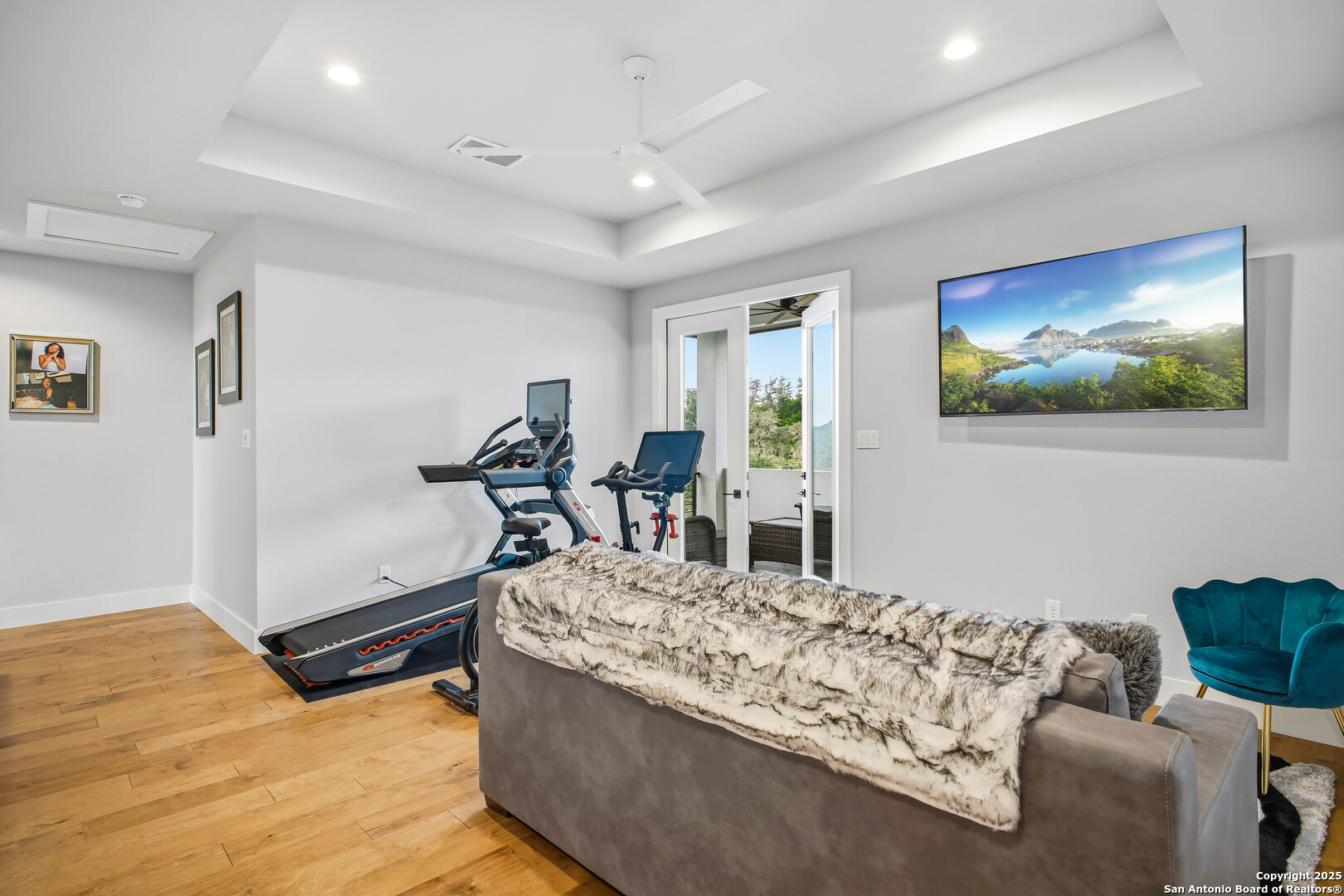 23315 Ebner Ridge San Antonio, TX 78255 - Photo 47 of 103 a living room with furniture and a flat screen tv