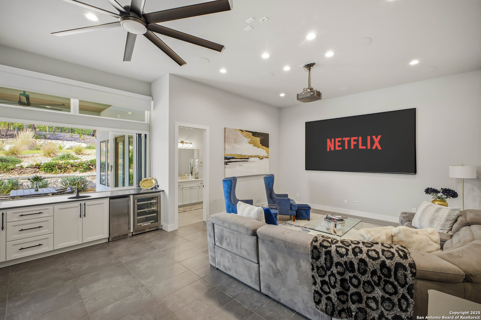 23315 Ebner Ridge San Antonio, TX 78255 - Photo 62 of 103 a living room with furniture a large window and a flat screen tv