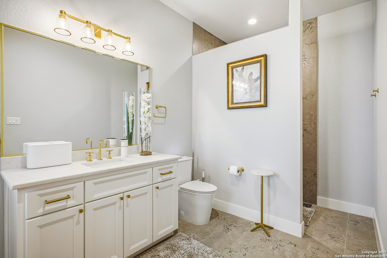 23315 Ebner Ridge San Antonio, TX 78255 - Photo 64 of 103 a bathroom with a toilet sink and mirror