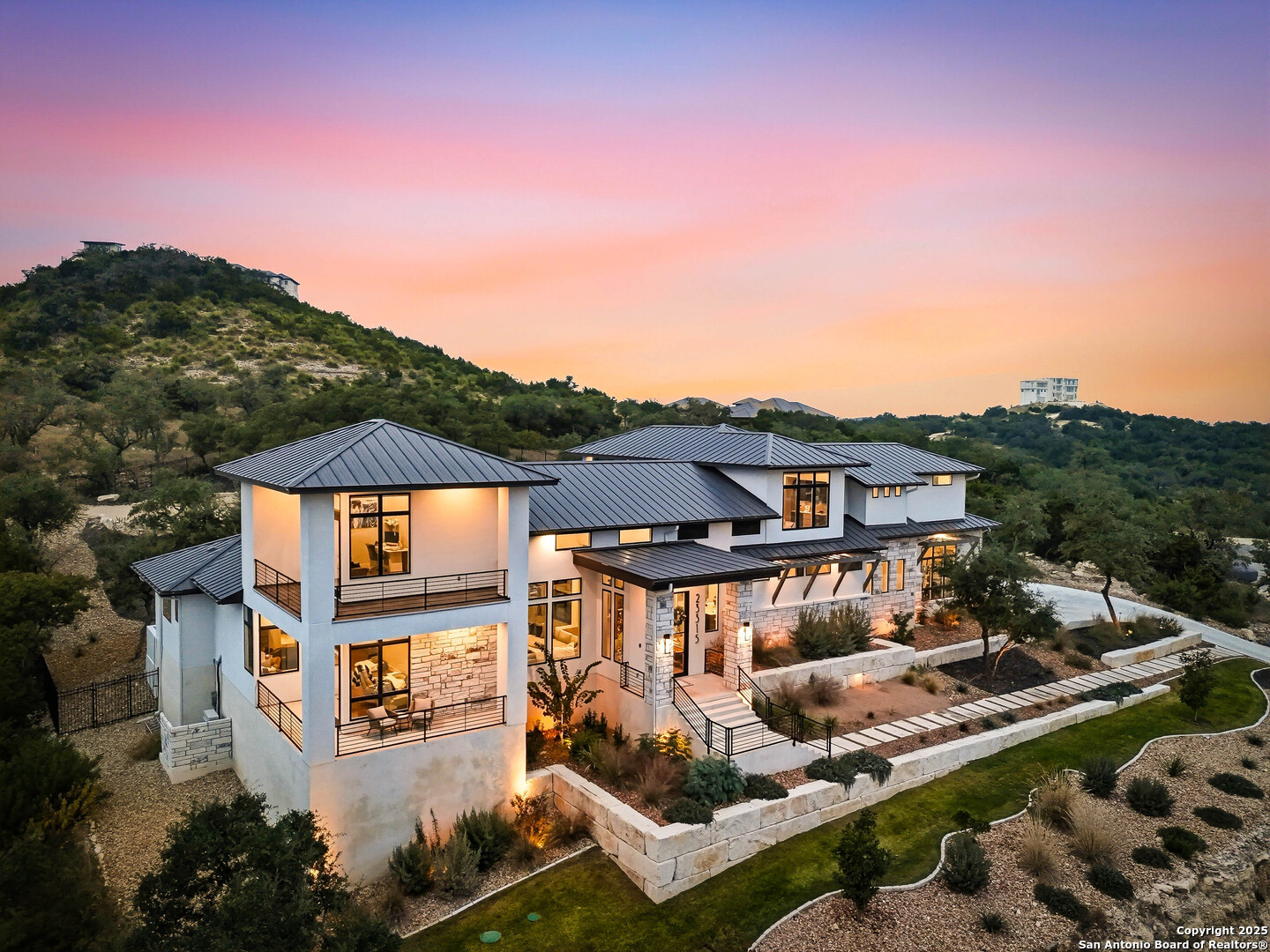 23315 Ebner Ridge San Antonio, TX 78255 - Photo 7 of 103 a front view of a house with a yard