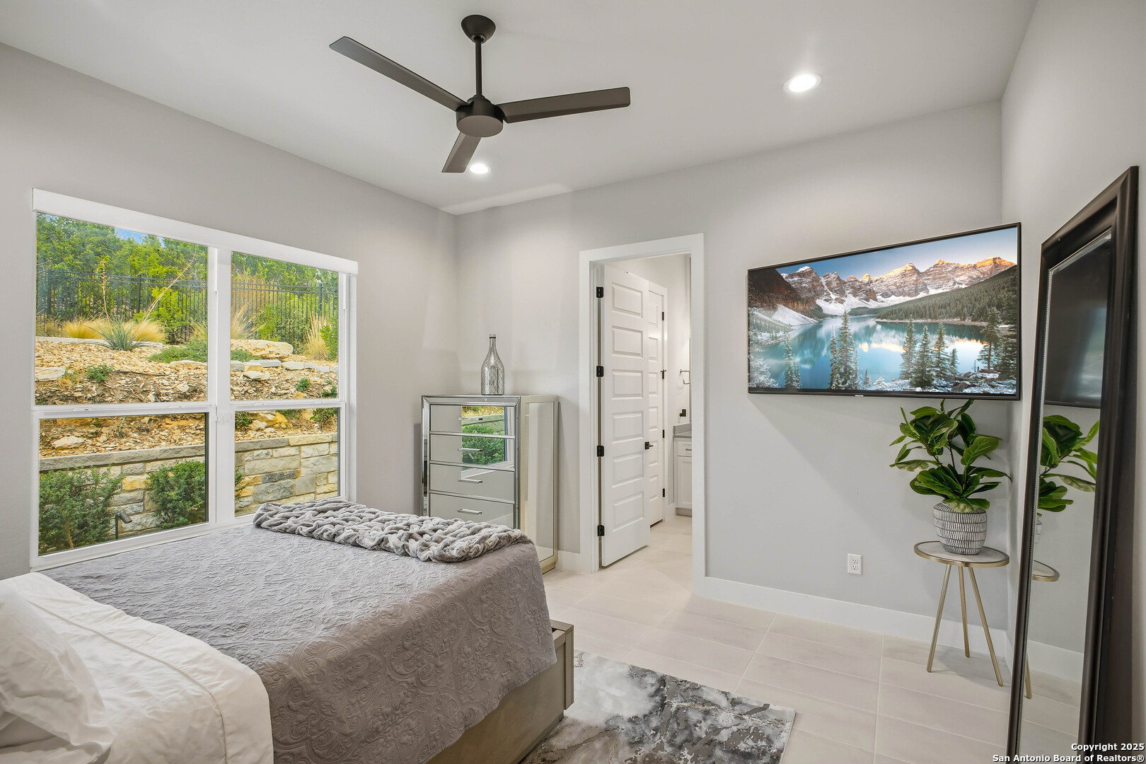 23315 Ebner Ridge San Antonio, TX 78255 - Photo 72 of 103 a bedroom with a large bed and a window