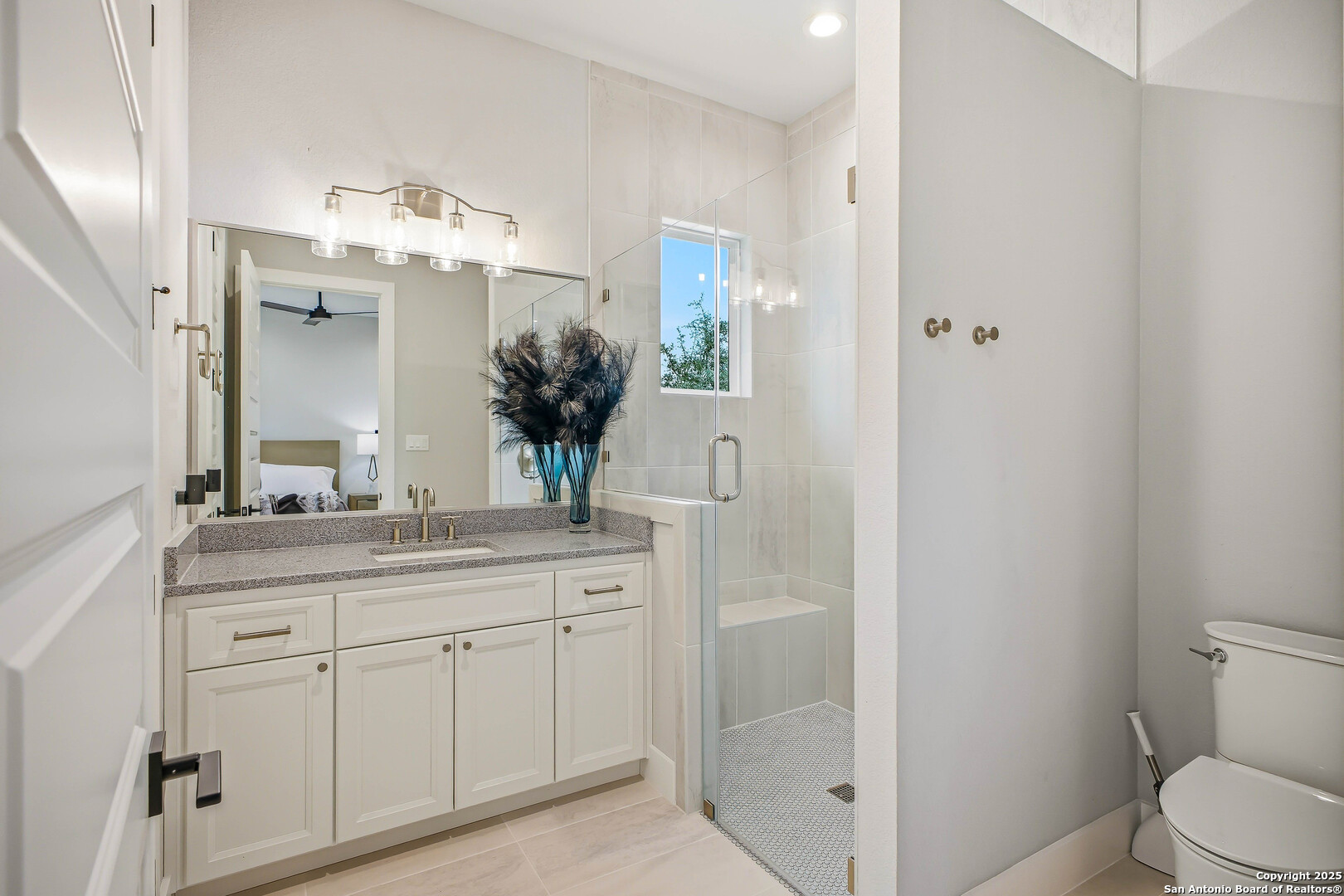 23315 Ebner Ridge San Antonio, TX 78255 - Photo 73 of 103 a bathroom with a granite countertop sink a toilet and a mirror